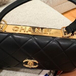 CHANEL Black Quilted Leather Shoulder Bag with Gold Accents